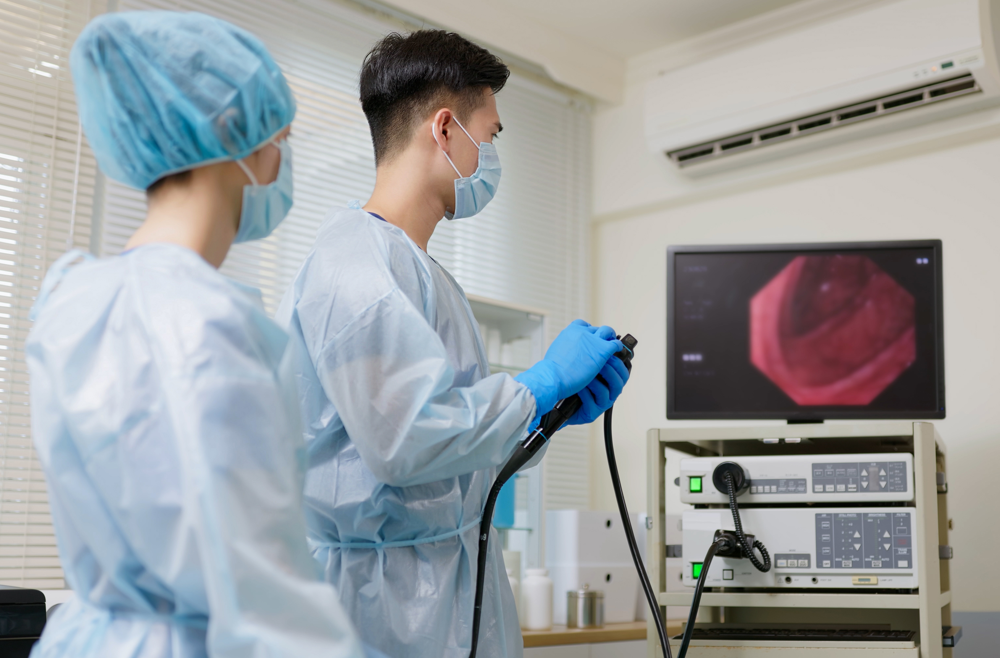 Two doctors examining a colorectal cancer screening.